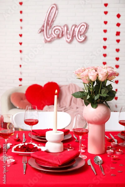 Fototapeta Table setting decorated for Valentine's Day with pink roses and candles at home