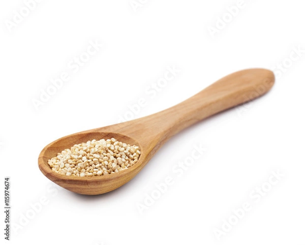 Fototapeta Spoon filled with quinoa seeds isolated