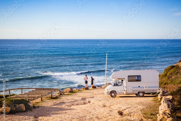 Fototapeta Camper van on a road trip near the beach on Algarve west coast
