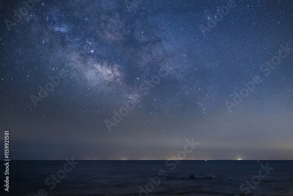 Fototapeta 天の川の中心部分が海の上に姿を見せる
