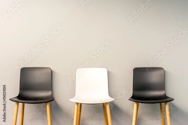 Obraz Modern chairs by the wall