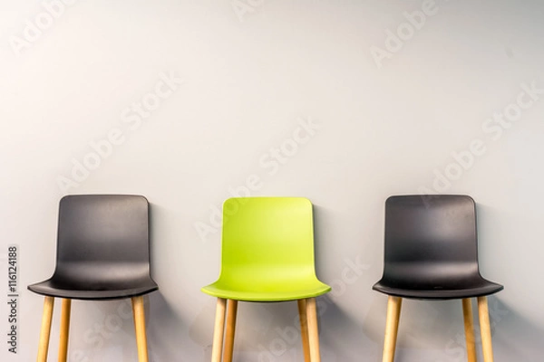 Obraz Modern chairs by the wall