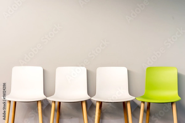 Obraz Modern chairs by the wall