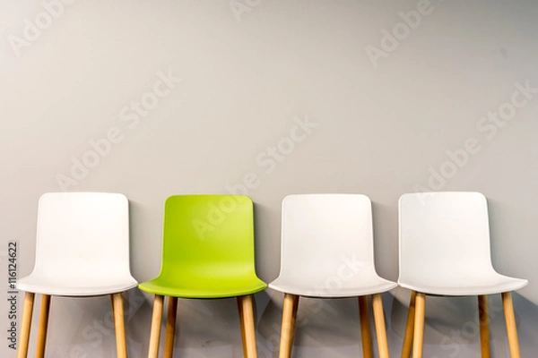 Obraz Modern chairs by the wall