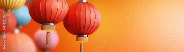 Fototapeta Colorful lanterns hang against vibrant orange background, creating festive atmosphere