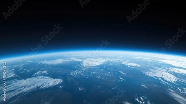 Fototapeta Earth's curve viewed from space, showing the atmosphere and land.