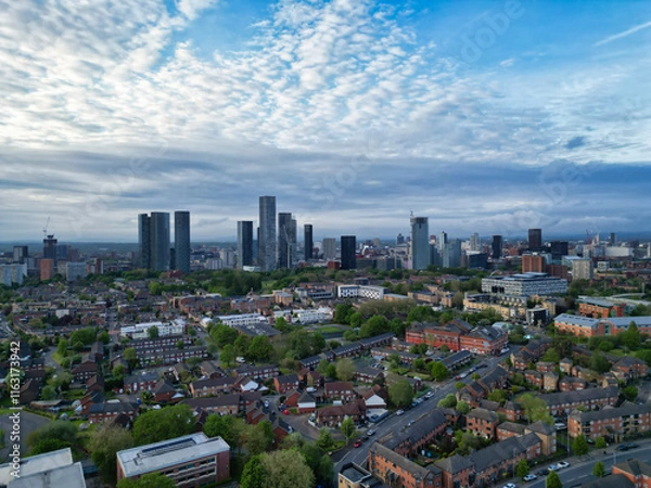 Fototapeta Aerial View of Buildings at Greater Manchester Central City, Northwest of England, United Kingdom. Aerial View Footage Was Captured with Drone's Camera on May 4th, 2024 During Sunset Time.