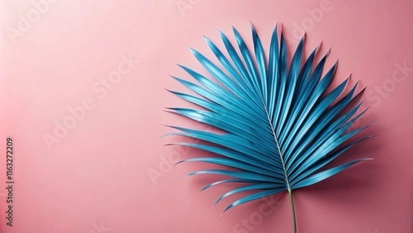 Fototapeta Vibrant Teal Palm Leaf on Soft Pink Background, Ideal for Summer Designs
