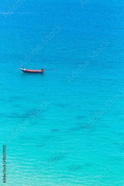 Obraz The boat in the azure ocean