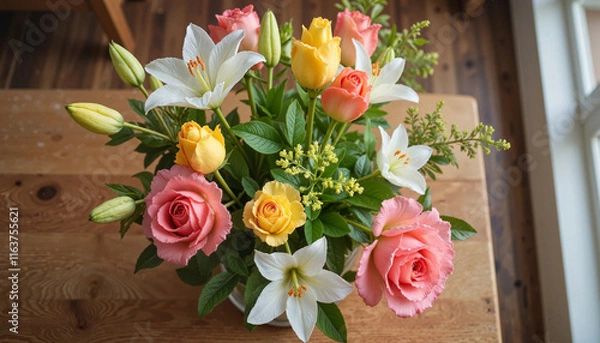 Fototapeta Vibrant floral arrangement with roses and lilies on wooden table, serenity