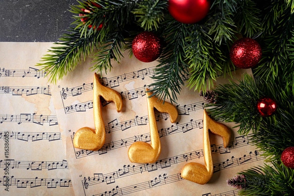Obraz Christmas decorations on music sheets