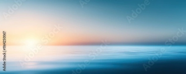 Fototapeta A serene seascape at dawn, featuring calm waters and a soft gradient of blue and orange hues in the sky.