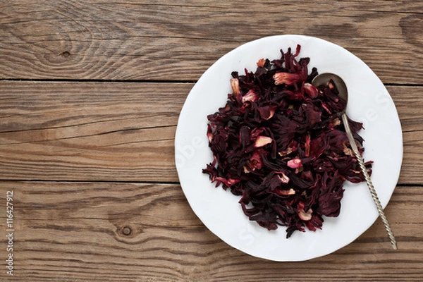 Fototapeta Hibiscus leaves on a plate with a spoon