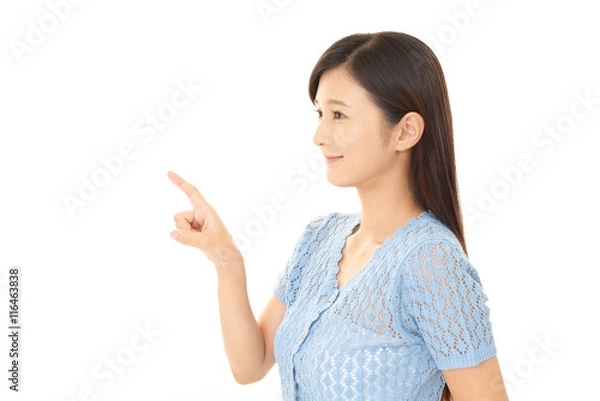 Fototapeta 指示する笑顔の女性