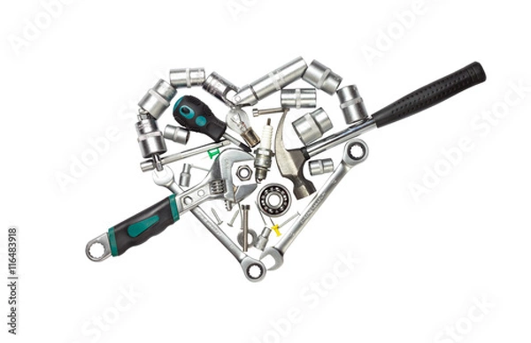 Fototapeta Tools arranged in a heart shape isolated on white background.