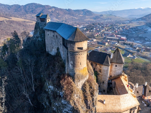 Fototapeta Aerial view of the Orava castle at winter, Slovakia. Medieval Oravsky Hrad castle on high and steep cliffs by the Orava River.