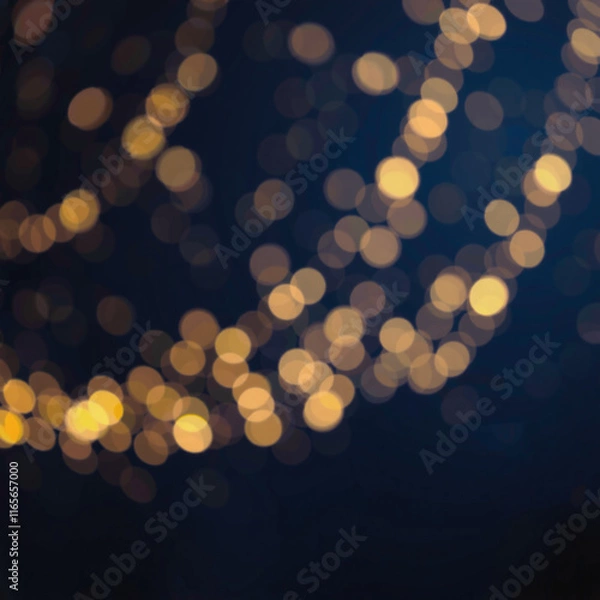 Fototapeta Abstract bokeh background with blurred white and yellow lights against a deep blue backdrop, creating a festive and dreamy atmosphere.