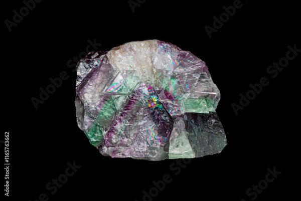 Fototapeta Natural rough rainbow fluorite gemstone on dark background (selective focus)