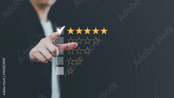 Fototapeta Hand touching and making a five-star yellow mark on a black background is customer satisfaction and the best evaluation for good quality products and services