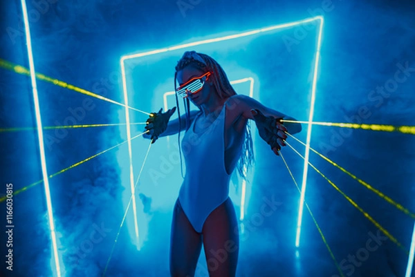 Fototapeta Young woman dancer posing in dark night club interior with green lasers