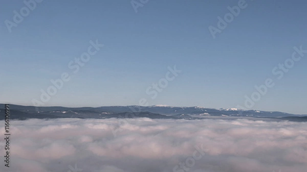 Fototapeta clouds over the mountains