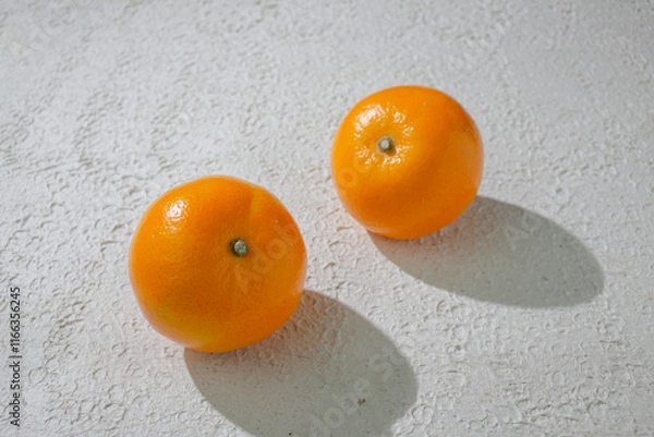 Fototapeta A vibrant orange isolated on a clean white background, representing freshness, health, and natural citrus goodness, ideal for food related visuals