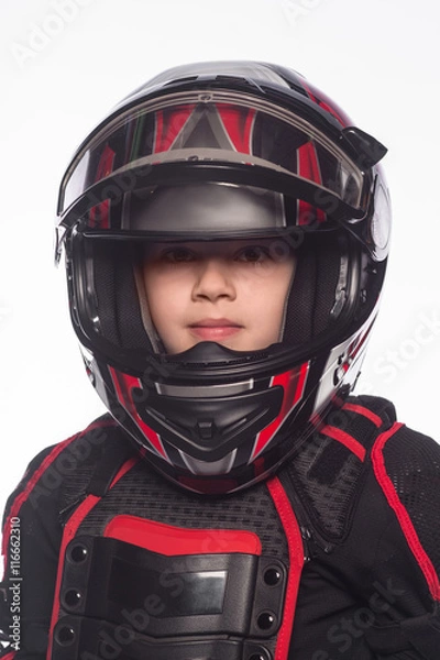 Fototapeta Race car or bike driver. The boy in the costume of the racer isolated on white background
