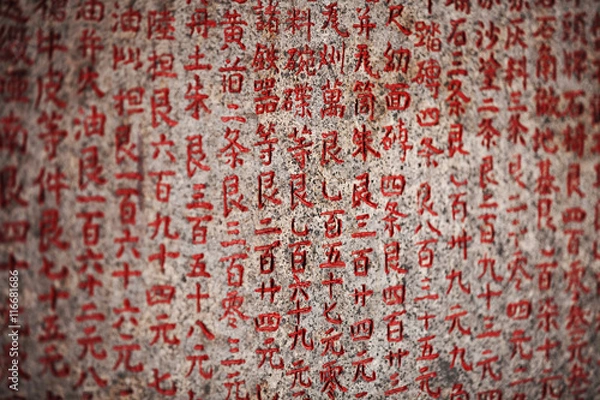 Obraz Hieroglyphs on the stone tablet in an old Buddhist temple