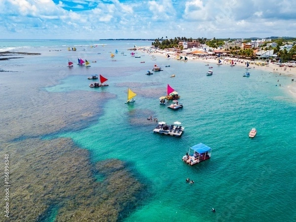 Obraz Porto de Galinhas - aerial view of the natural pools of Porto de Galinhas at low tide full of rafts