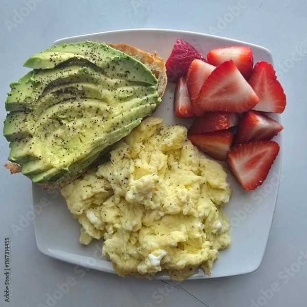 Fototapeta Healthy breakfast with avocado toast on sourdough and eggs