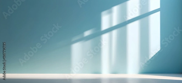 Fototapeta Light blue wall with the shadows of window frames falling on it