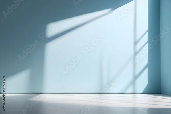 Fototapeta Sunlight casting shadows in empty room with blue walls