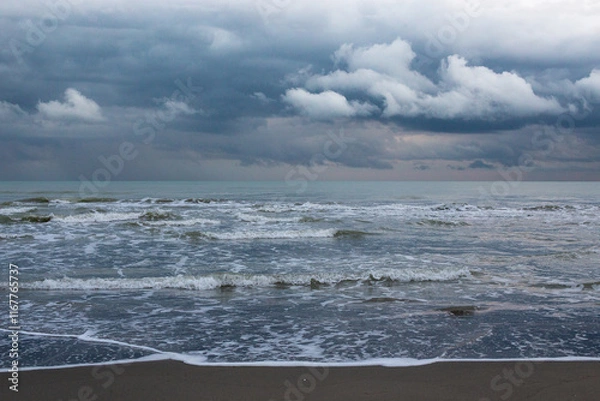 Obraz storm clouds forming over the sea waves crashing on the beach in northern iran shomal the caspian sea