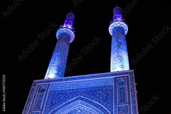 Obraz The Jāmeh aka jame Mosque of Yazd beautiful persian architecture with mosaic tile work ceramic geometric shapes minarets islamic architecture at night 