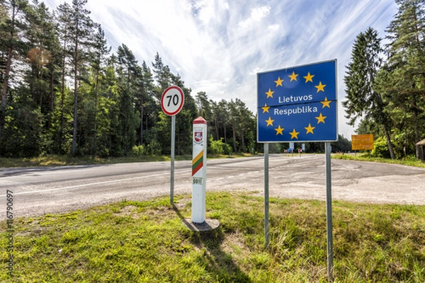 Fototapeta Lithuania country border sign between Latvia and Lithuania with coat of arms and flag. EU flag sign with lithuanian text the Republic of Lithuania.