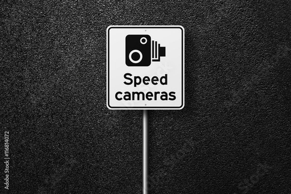 Fototapeta Road sign on a background of asphalt. Speed-limit cameras. The texture of the tarmac, top view.