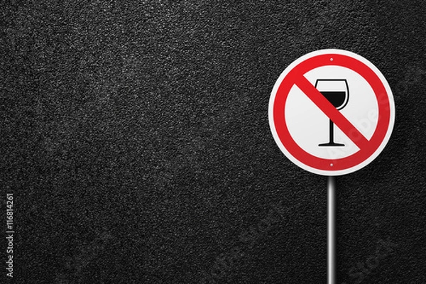 Fototapeta Road sign of the circular shape on a background of asphalt. No alcohol. The texture of the tarmac, top view.