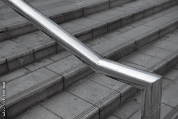 Fototapeta Close up image of stainless steel handrails are installed on the walls and steps.