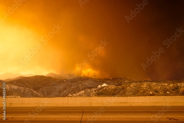 Obraz Wildfire in the mountains near freeway