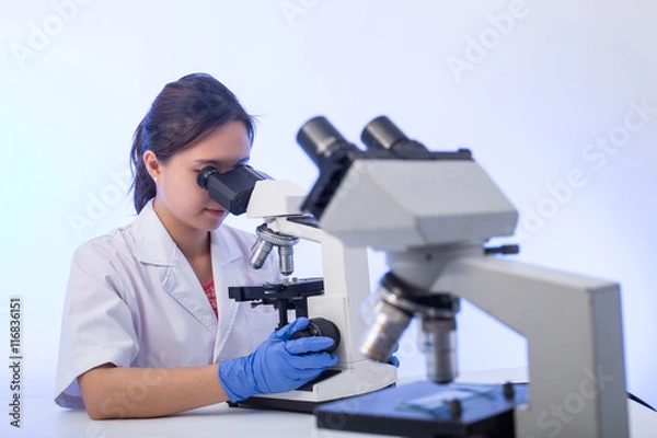 Fototapeta Laboratory microscope research. Scientist people study and anlaysis in lab room.