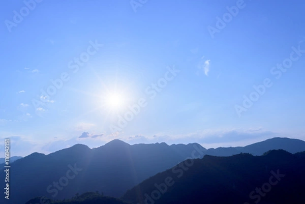 Obraz Sun flare with blue sky and mountains