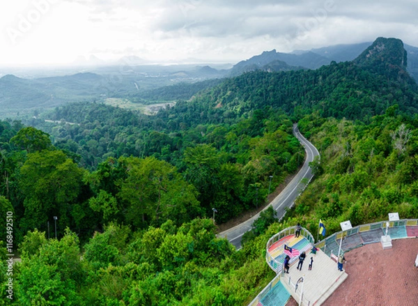 Fototapeta Aerial drone view of  mountain viewpoint surrounded with greenery rainforest at Wang Kelian, Perlis, Malaysia.