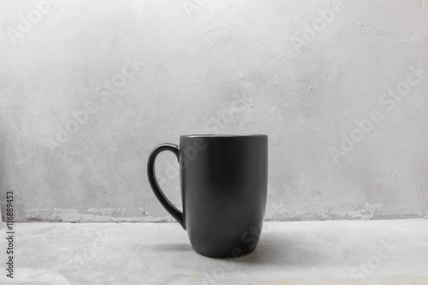 Obraz Black coffee mug on concrete table