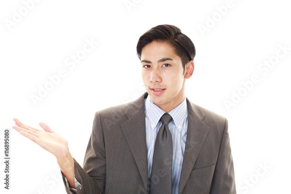 Fototapeta 案内する笑顔のビジネスマン