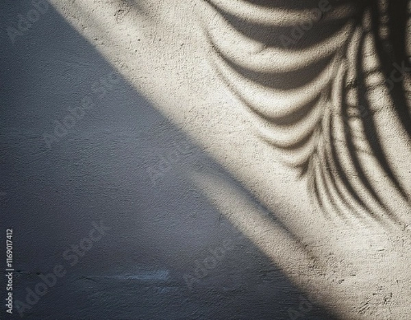 Fototapeta shadow of palm leaves on a concrete wall abstract background for design