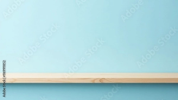 Fototapeta Empty light wood shelf against a pale blue wall background ideal for product display