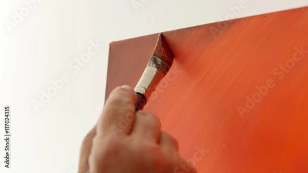 Obraz An artist is showing some techniques of painting