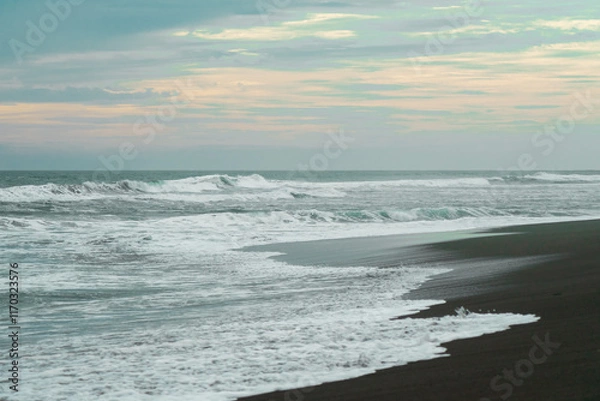 Obraz waves breaking on the beach. Ocean waves breaking on a  beach. Close up shot of breaking wave Pandansari beach, Central Java, Indonesia.