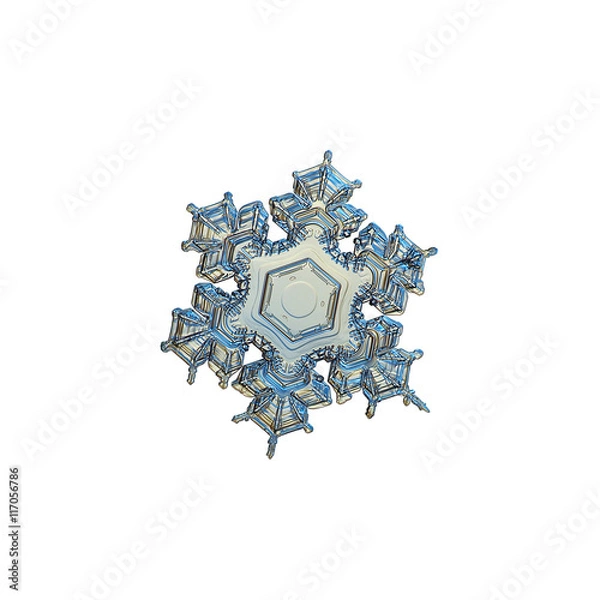 Fototapeta Snowflake isolated on white background. This is macro photo of real snow crystal with short arms with complex pattern and almost empty center, captured in yellow light at glass surface.