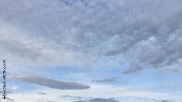 Fototapeta Tranquil Sky with Soft Clouds in the Early Evening Atmosphere